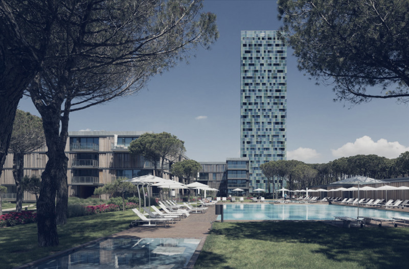  Vista dal giardino interno con la piscina e gli edifici residenziali in primo piano. Nello sfondo la grande torre vetrata.
